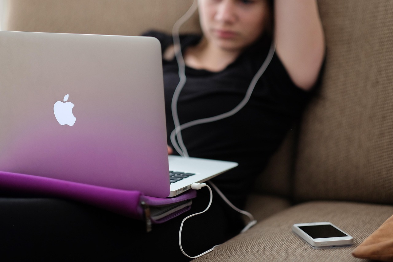 apple, computer, girl, iphone, working, laptop, macbook air, woman, couch, sit, sitting, macbook, apple products, work from home, apple, apple, apple, apple, computer, iphone, iphone, iphone, iphone, iphone, laptop, laptop, laptop, couch, macbook, macbook
